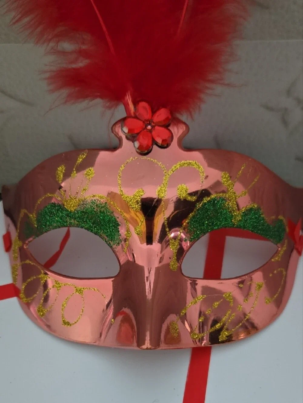 Red Feathered Masquerade Mask with Green Accents